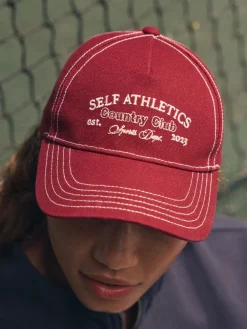 self. Red Slogan Cap Outlet